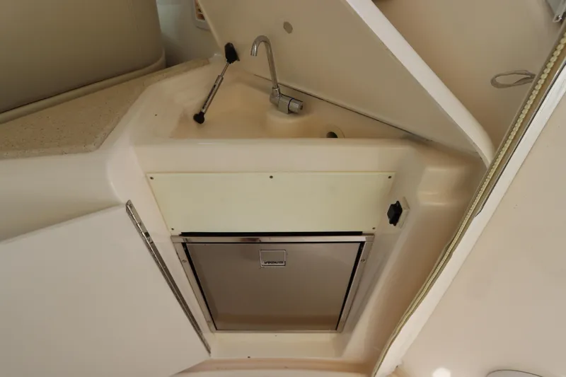 Slide: The Image of 2008 Tiara Yachts 4300 Sovran interior sink and storage area. - 24