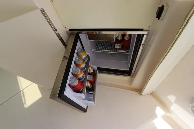 Slide: The Image of Mini fridge stocked with beverages on a 2008 Tiara Yachts 4300 Sovran. - 25