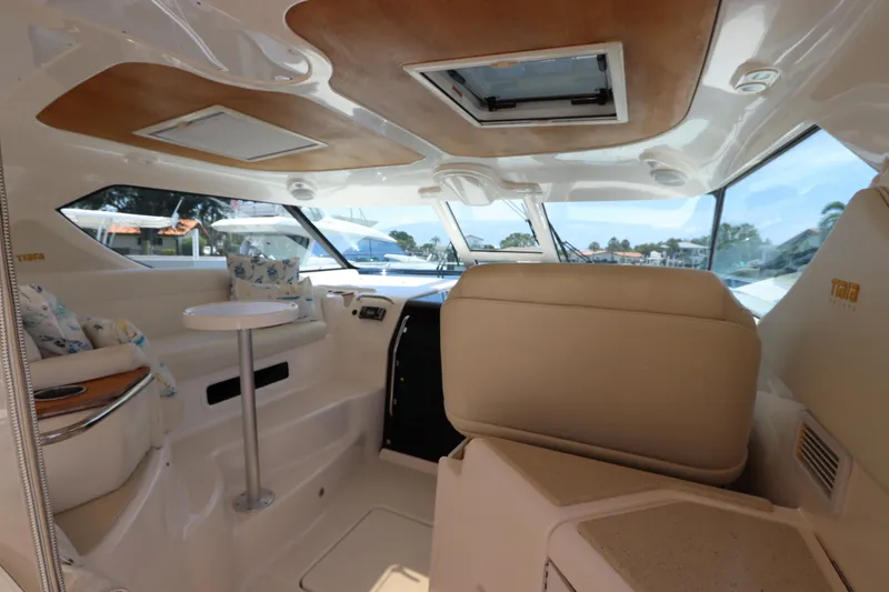 Slide: The Image of Interior of 2008 Tiara Yachts 4300 Sovran, featuring seating and windows. - 26