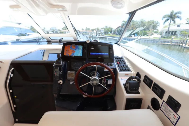 Slide: The Image of Helm of 2008 Tiara Yachts 4300 Sovran with navigation equipment and steering wheel. - 31