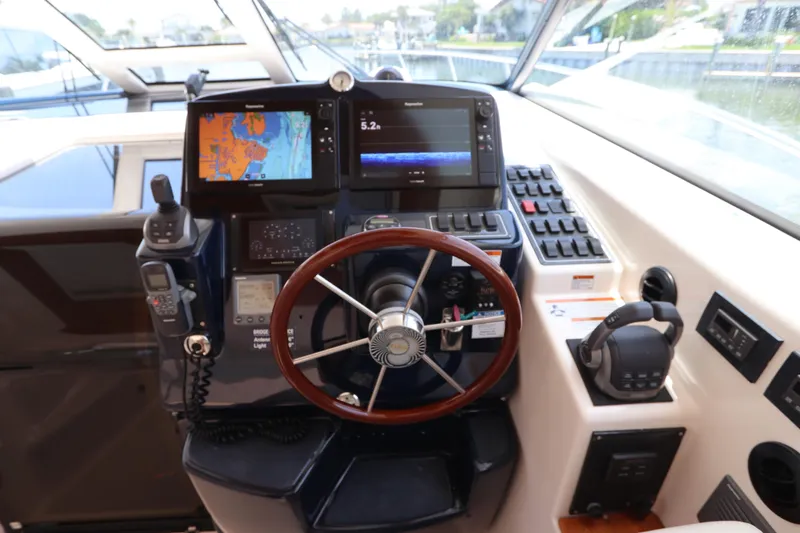 Slide: The Image of Cockpit of 2008 Tiara Yachts 4300 Sovran with navigation equipment and steering wheel. - 32