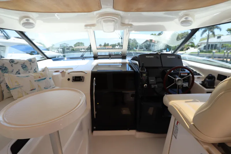 Slide: The Image of Interior of 2008 Tiara Yachts 4300 Sovran, featuring helm and seating area. - 37