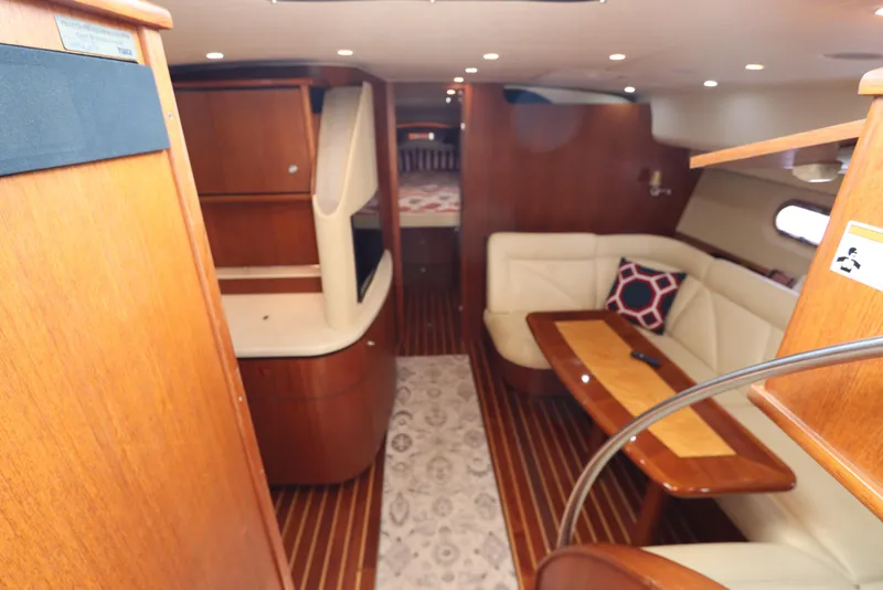Slide: The Image of 2008 Tiara Yachts 4300 Sovran interior with elegant wood finish and cozy seating area. - 39