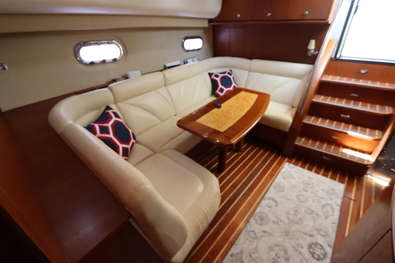 Slide: The Image of Luxurious interior of 2008 Tiara Yachts 4300 Sovran with elegant seating and wooden accents. - 40