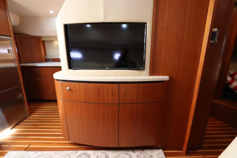 Slide: The Image of Interior of 2008 Tiara Yachts 4300 Sovran with TV and wooden cabinetry. - 42