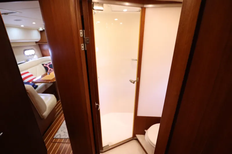 Slide: The Image of Interior of 2008 Tiara Yachts 4300 Sovran, featuring a cozy cabin and bathroom. - 47