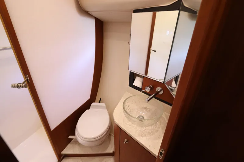 Slide: The Image of Luxurious bathroom in 2008 Tiara Yachts 4300 Sovran, featuring modern fixtures and elegant design. - 48