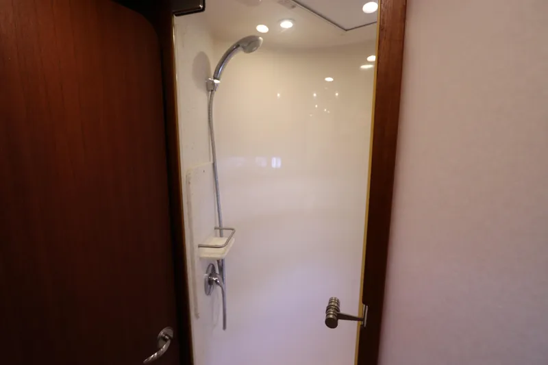 Slide: The Image of Shower area inside 2008 Tiara Yachts 4300 Sovran, featuring sleek design and modern fixtures. - 49