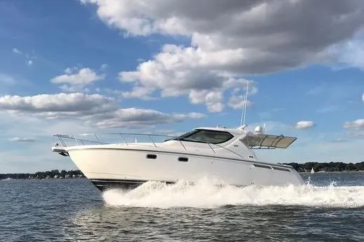 Slide: The Image of 2008 Tiara Yachts 4300 Sovran cruising on a sunny day with blue skies. - 5