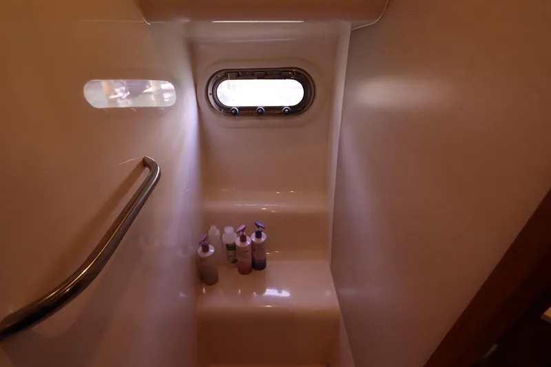 Slide: The Image of Bathroom interior of 2008 Tiara Yachts 4300 Sovran with porthole and toiletries. - 50