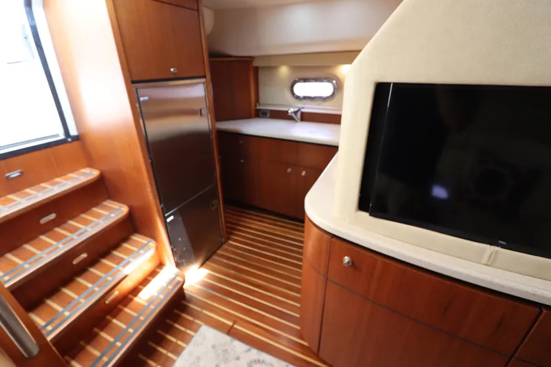 Slide: The Image of Luxurious interior of 2008 Tiara Yachts 4300 Sovran with wood finishes and modern amenities. - 51