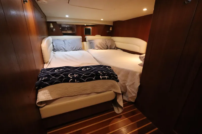 Slide: The Image of Luxurious cabin interior of 2008 Tiara Yachts 4300 Sovran with cozy bedding. - 62