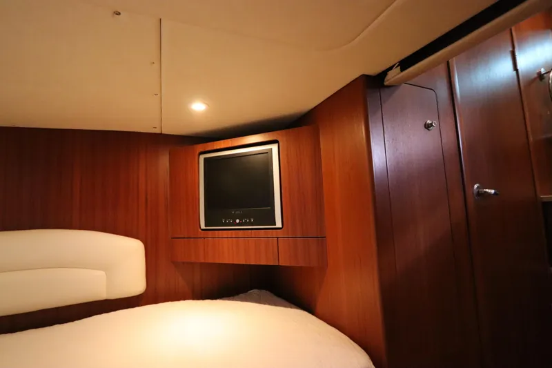 Slide: The Image of Interior of 2008 Tiara Yachts 4300 Sovran with wood paneling and built-in TV. - 63