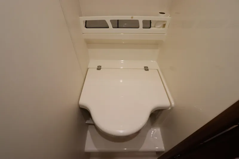 Slide: The Image of 2008 Tiara Yachts 4300 Sovran bathroom with compact white toilet. - 67