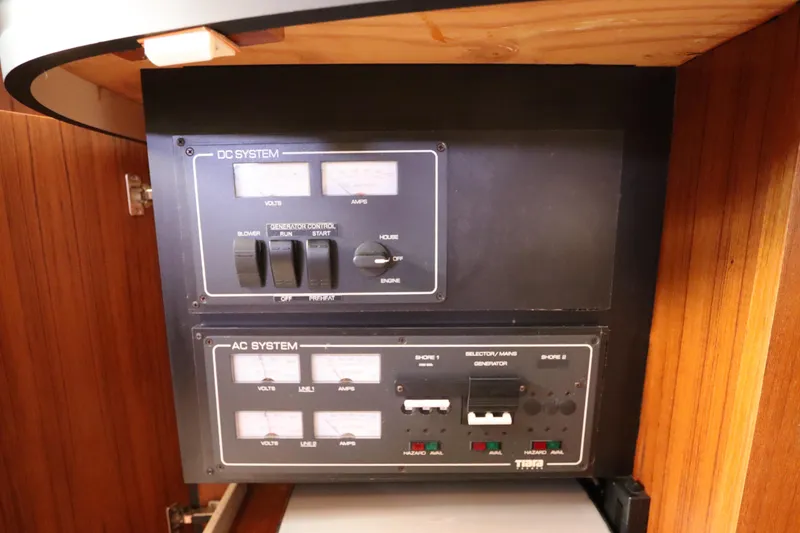 Slide: The Image of Electrical control panel on a 2008 Tiara Yachts 4300 Sovran, featuring AC and DC systems. - 69