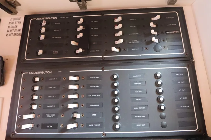 Slide: The Image of Electrical control panel on a 2008 Tiara Yachts 4300 Sovran, featuring AC and DC distribution. - 70