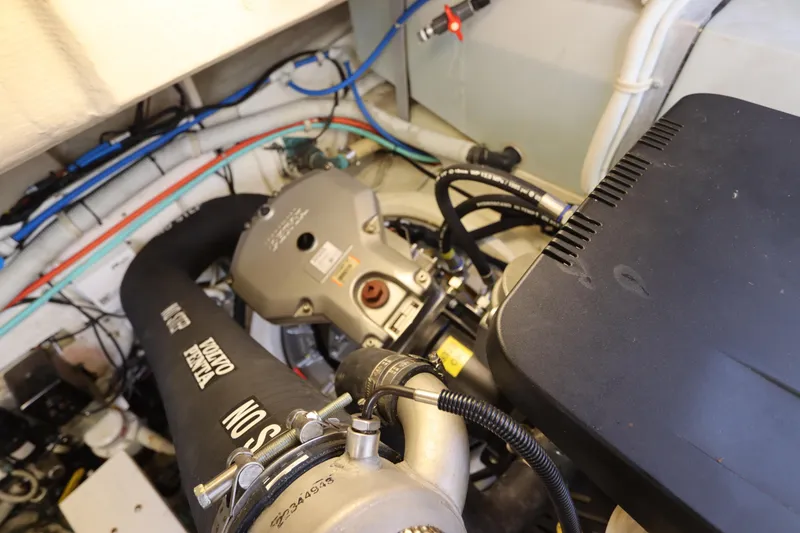 Slide: The Image of Engine compartment of a 2008 Tiara Yachts 4300 Sovran, featuring Volvo Penta components. - 76