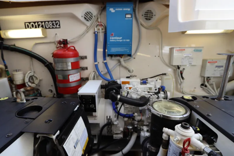 Slide: The Image of Engine room of 2008 Tiara Yachts 4300 Sovran with equipment and fire extinguisher. - 77