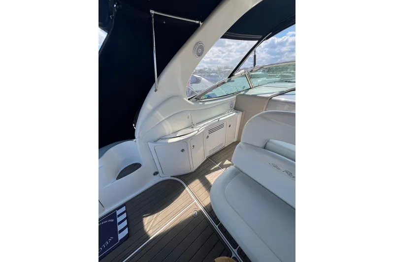 Slide: The Image of Interior view of 2003 Sea Ray 360 Sundancer yacht with sleek seating and cabinetry. - 14