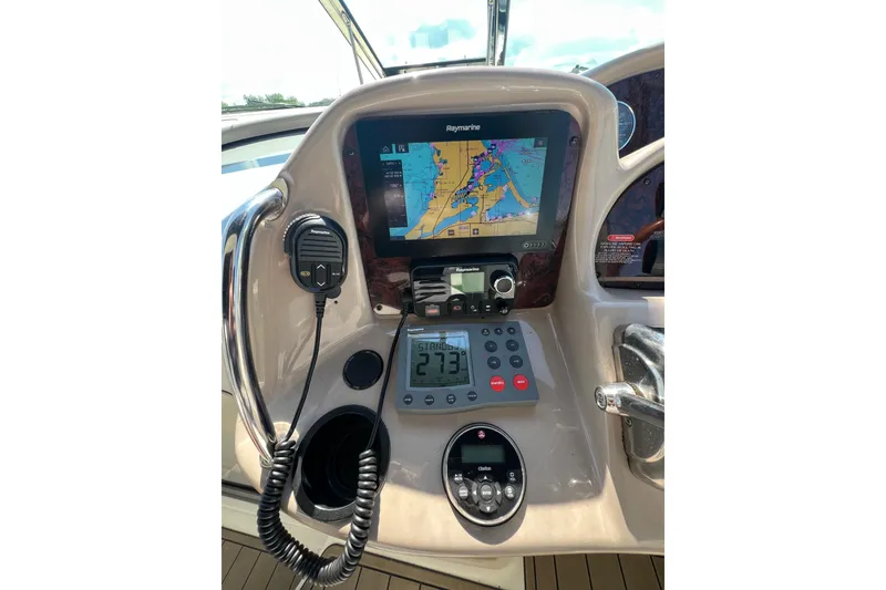 Slide: The Image of Control panel of a 2003 Sea Ray 360 Sundancer with navigation equipment. - 17