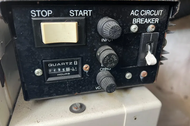 Slide: The Image of Control panel of a 2003 Sea Ray 360 Sundancer with hour meter and circuit breaker. - 20