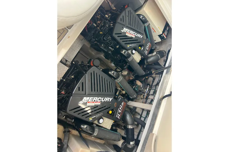 Slide: The Image of Engine compartment of a 2003 Sea Ray 360 Sundancer with twin Mercury engines. - 21