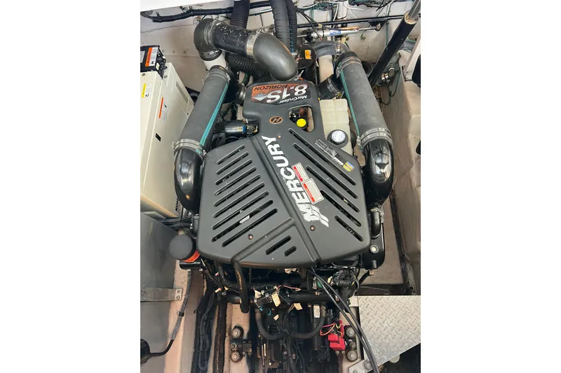 Slide: The Image of Engine compartment of a 2003 Sea Ray 360 Sundancer with Mercury components. - 22
