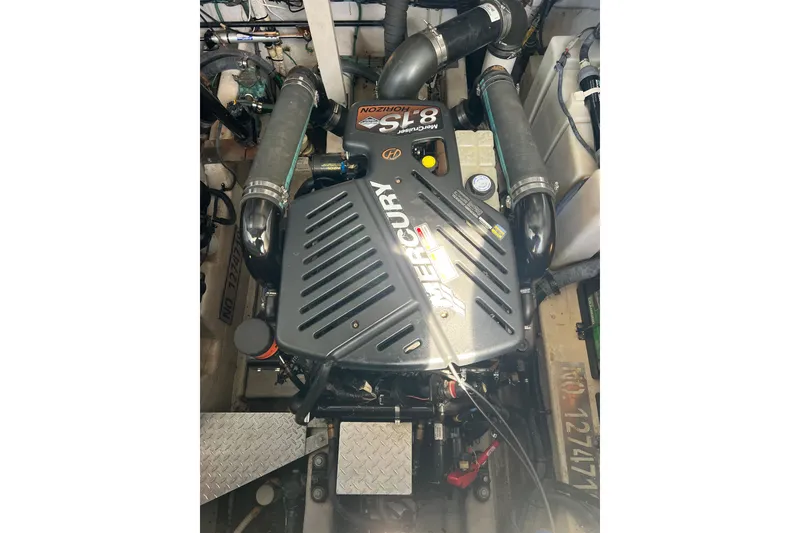 Slide: The Image of Engine compartment of a 2003 Sea Ray 360 Sundancer with a Mercury 8.1L engine. - 23