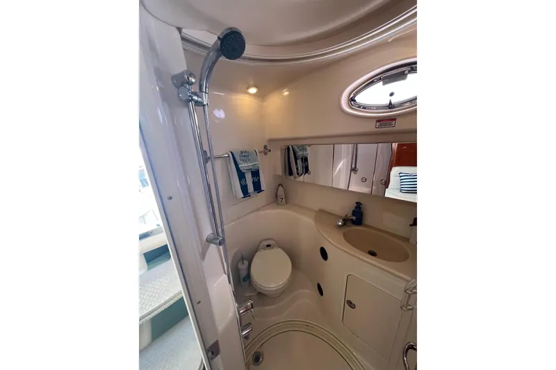 Slide: The Image of Bathroom interior of 2003 Sea Ray 360 Sundancer yacht, featuring shower and sink. - 25