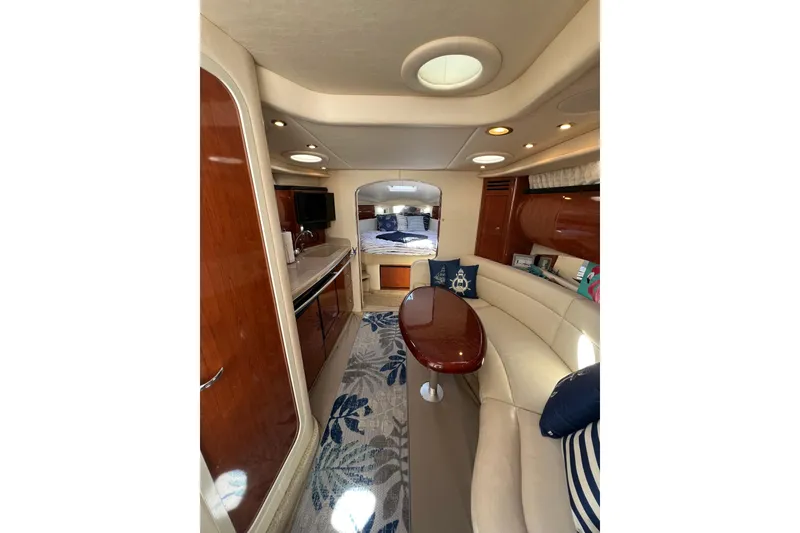 Slide: The Image of Luxurious interior of a 2003 Sea Ray 360 Sundancer yacht with elegant seating and decor. - 28