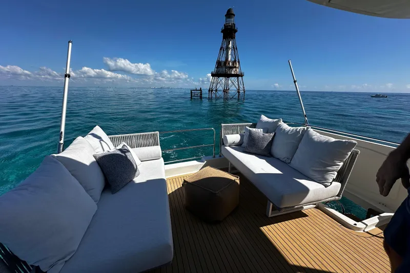 Slide: The Image of Luxurious deck of 2019 Beneteau Swift Trawler 47 with ocean view and lighthouse. - 3