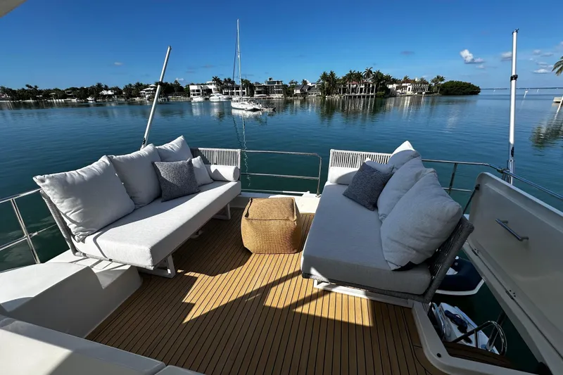 Slide: The Image of Luxurious deck seating on 2019 Beneteau Swift Trawler 47, overlooking serene waterfront views. - 4