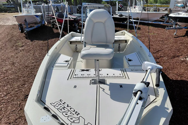 Slide: The Image of 2016 Express 20 BAY boat with seating and fishing equipment on display. - 12