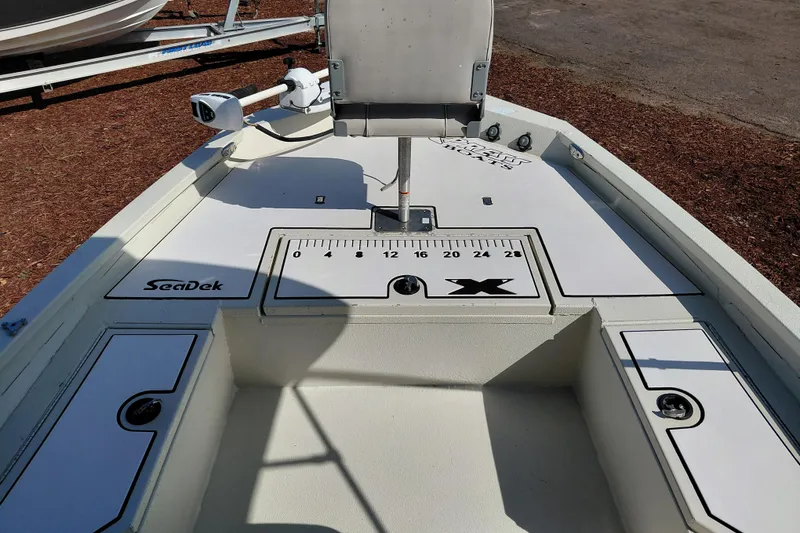 Slide: The Image of 2016 Express 20 BAY boat deck with SeaDek flooring and measurement markings. - 18