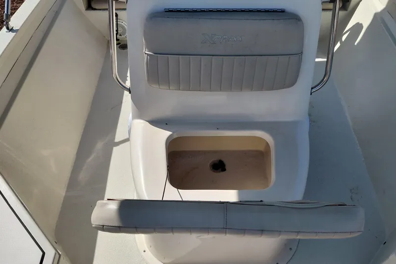 Slide: The Image of 2016 Express 20 BAY boat interior with seating and storage compartment. - 19