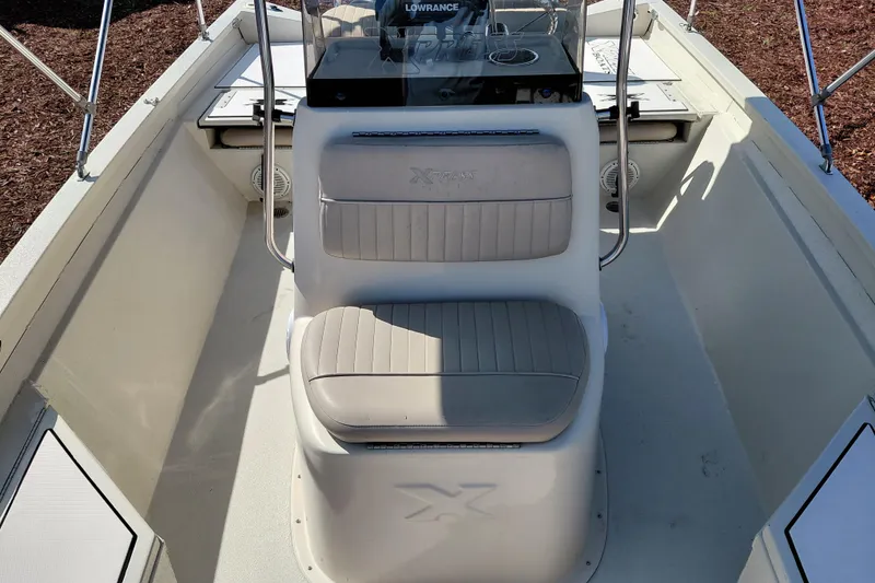 Slide: The Image of 2016 Express 20 BAY boat interior with seating and console. - 20