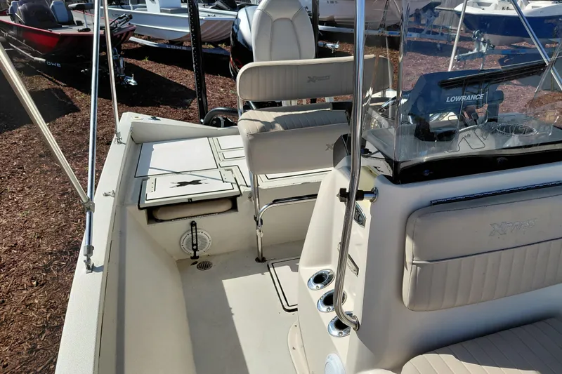 Slide: The Image of 2016 Express 20 BAY boat interior with seating and navigation equipment. - 21