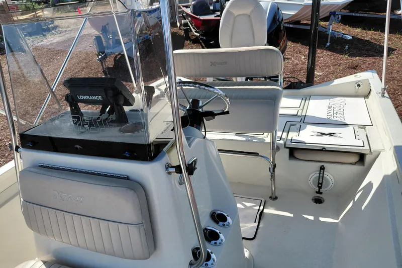 Slide: The Image of 2016 Express 20 BAY boat interior with steering console and seating. - 22