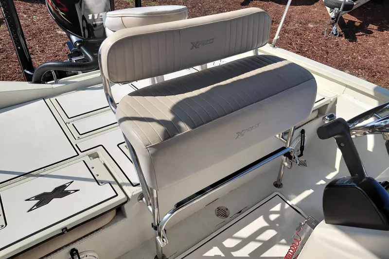 Slide: The Image of 2016 Express 20 BAY boat interior with seating and Yamaha motor. - 24