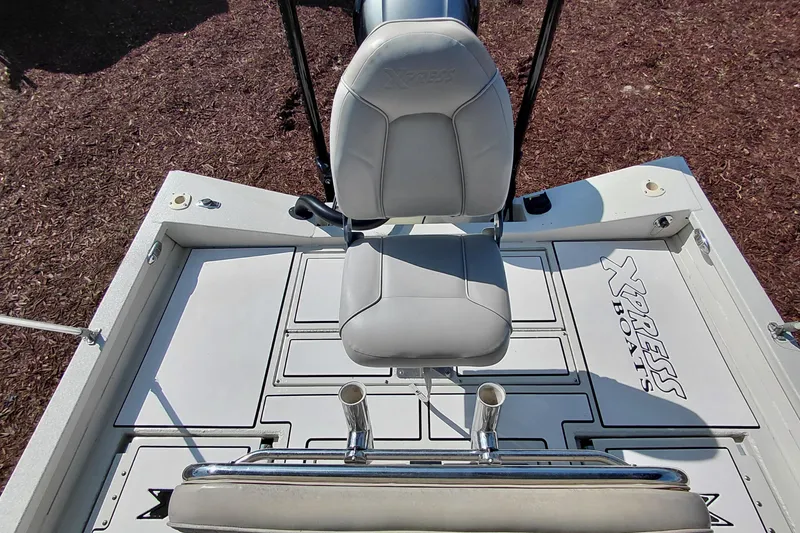 Slide: The Image of 2016 Express 20 BAY boat seat and deck, featuring Xpress Boats branding. - 26