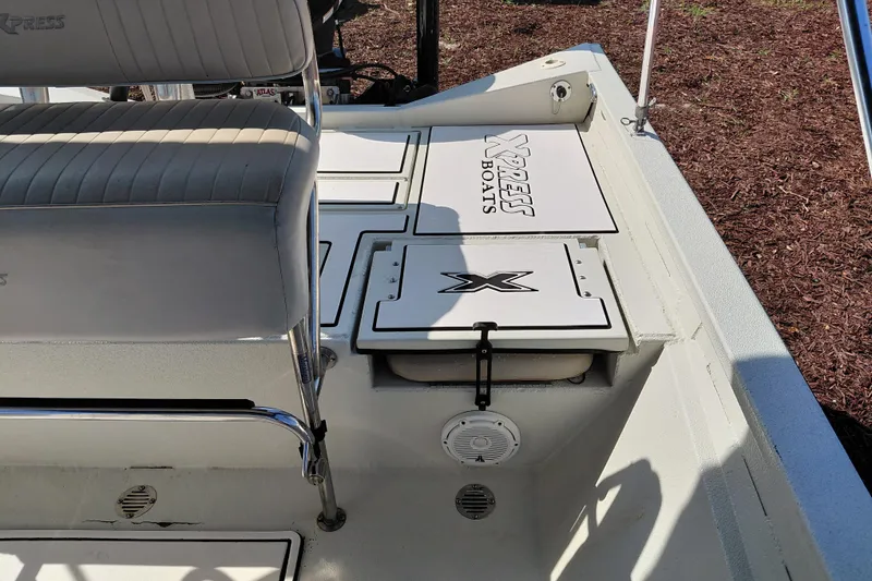 Slide: The Image of 2016 Express 20 BAY boat interior with seating and storage compartments. - 31