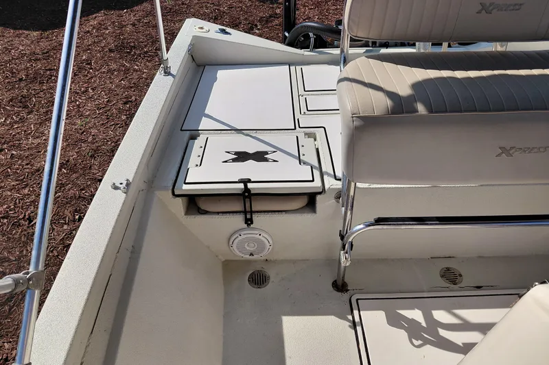 Slide: The Image of 2016 Express 20 BAY boat interior with seating and storage compartments. - 32