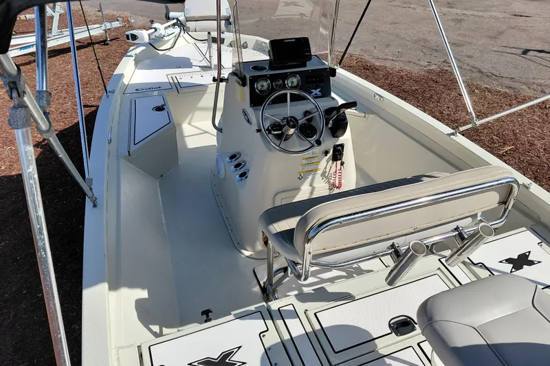 Slide: The Image of 2016 Express 20 BAY boat interior with steering console and seating. - 34