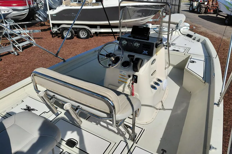 Slide: The Image of 2016 Express 20 BAY boat interior with steering console and seating. - 35