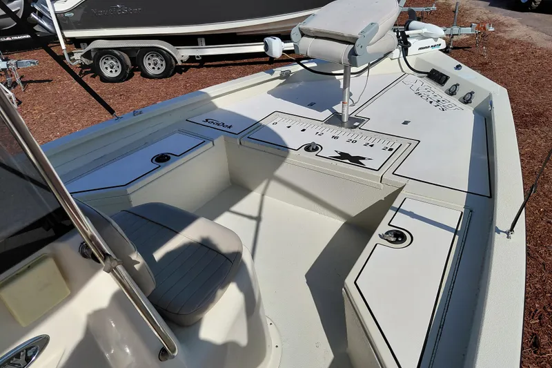 Slide: The Image of 2016 Express 20 BAY boat interior with seating and control panel. - 37