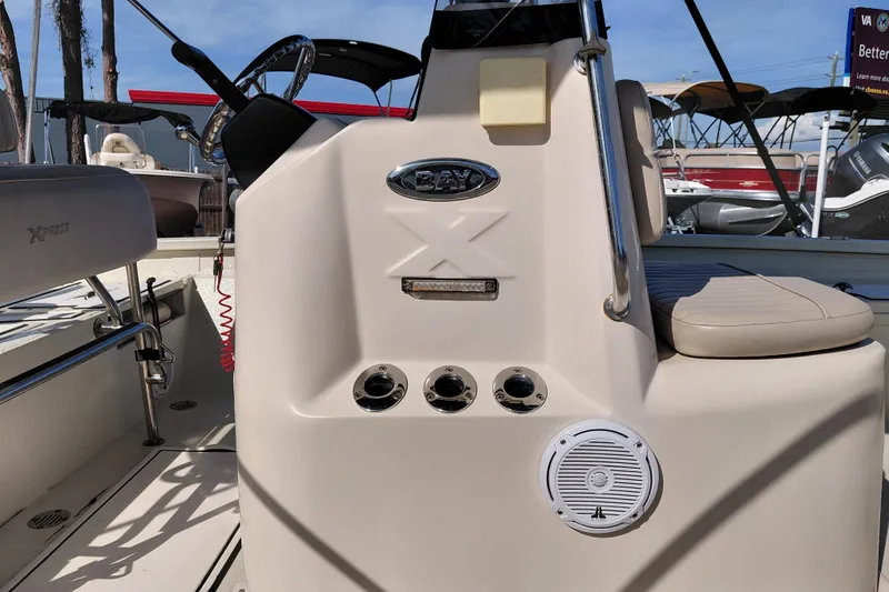 Slide: The Image of 2016 Express 20 BAY boat interior with steering wheel and seating. - 38
