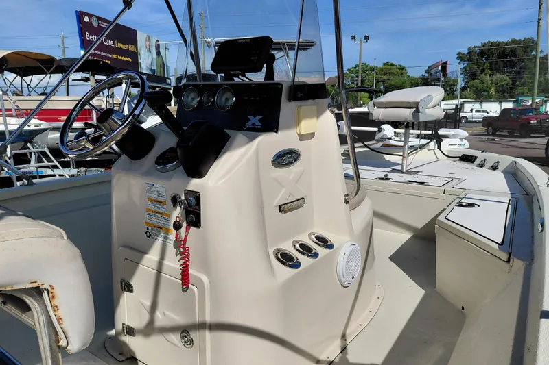 Slide: The Image of 2016 Express 20 BAY boat interior with steering console and seating. - 39
