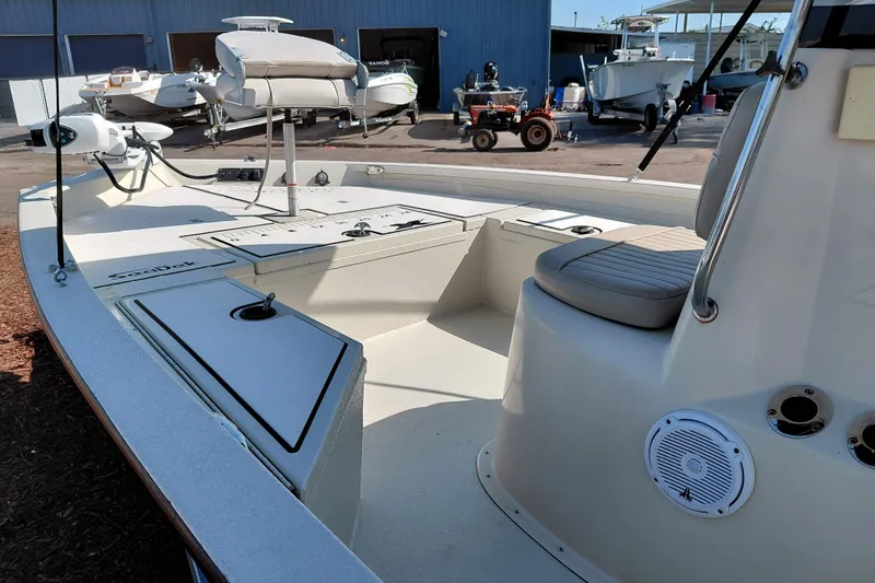 Slide: The Image of 2016 Express 20 BAY boat interior with seating and storage compartments. - 41