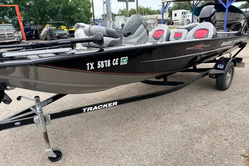 Slide: The Image of 2025 Tracker Bass Tracker Classic XL boat on trailer, parked outdoors. - 10