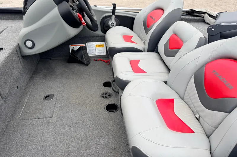 Slide: The Image of 2025 Tracker Bass Tracker Classic XL boat interior with gray and red seating. - 6
